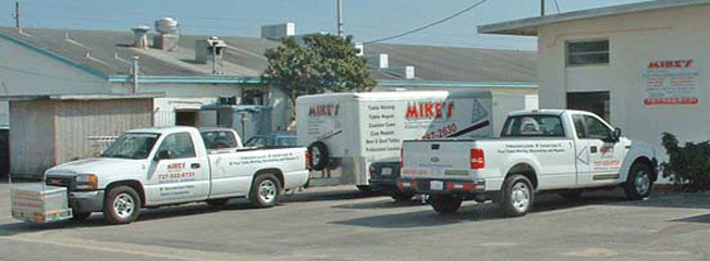  2 of the 4 tow vehicles and 1 of the 4 cargo trailers setup specially to transport pool tables and billiard tables safely in the 85 Counties in Georgia that Mike's Billiard Supplies and Crating provides service to.