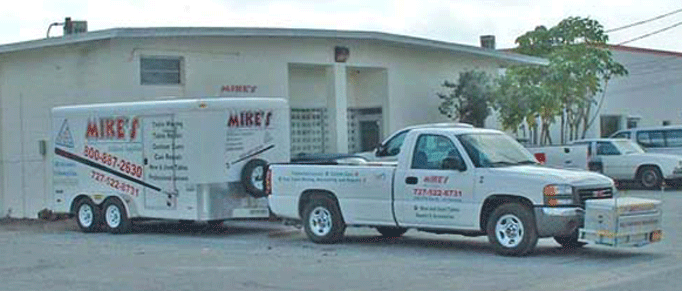 GMG 2004 Tow vehicle and a 14' cargo trailer setup specially to transport pool tables and billiard tables safely in the 85 Counties in Georgia that Mike's Billiard Supplies and Crating provides service to.